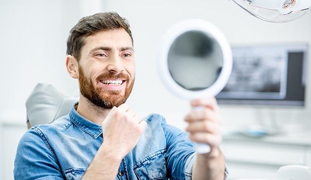 a male patient is getting dental exams and cleanings in Geneva, IL at Randall Pointe Dental.